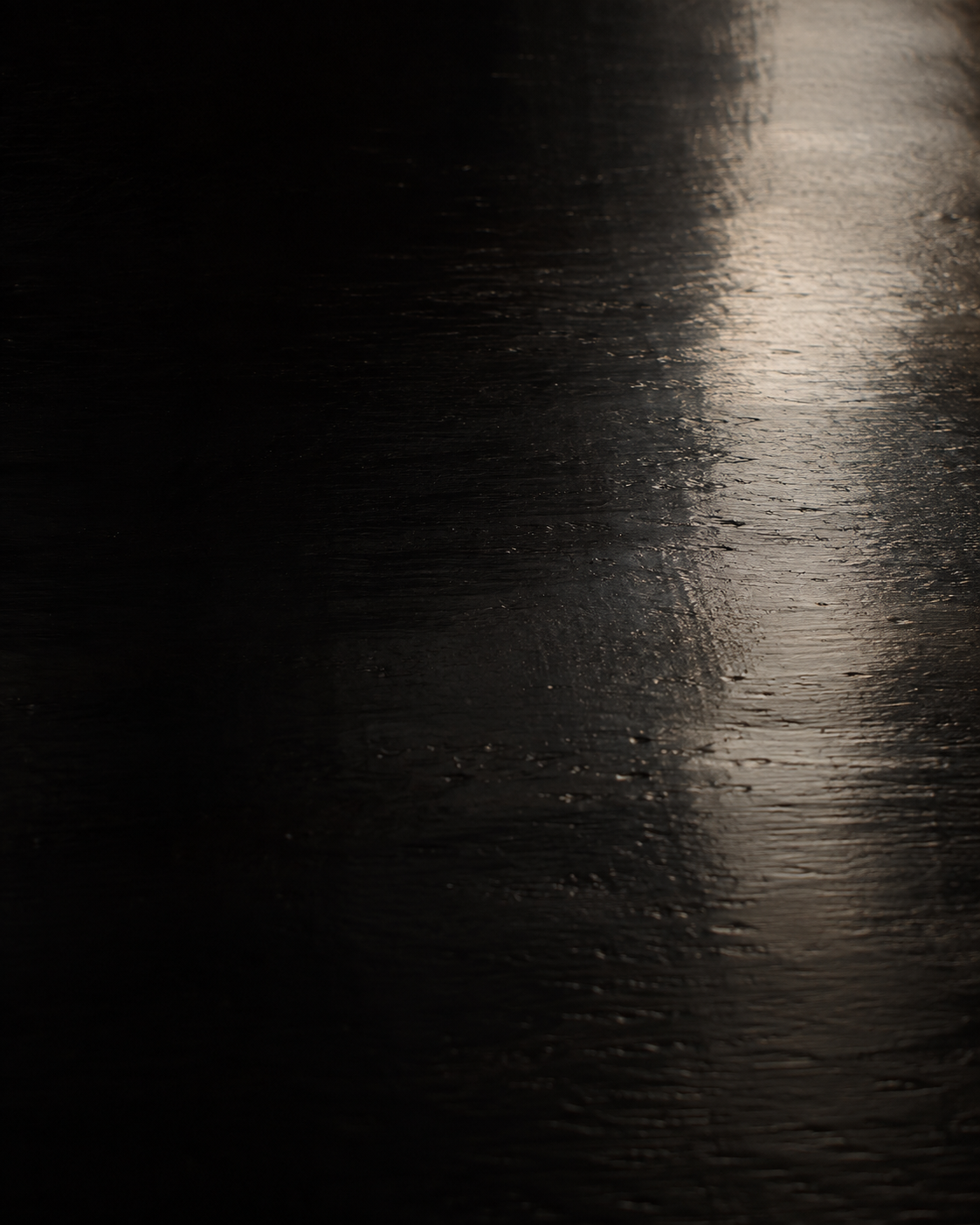 Lacquer surface mid-polish under a single directional light